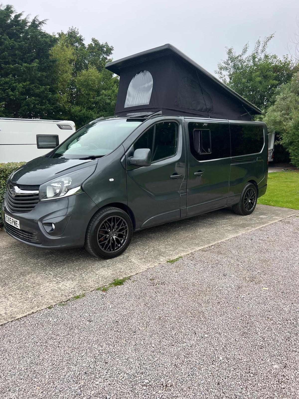 Dark graphite JMC pop-top campervan with roof raised